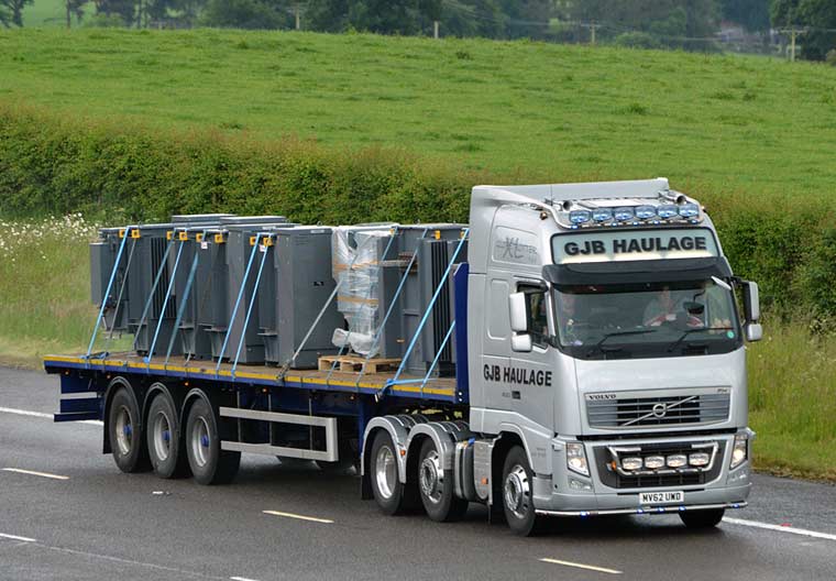 44t lorry towing a flatbed trailer