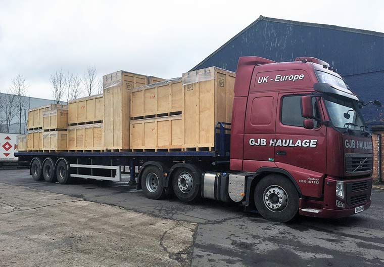 44t lorry towing a flatbed trailer