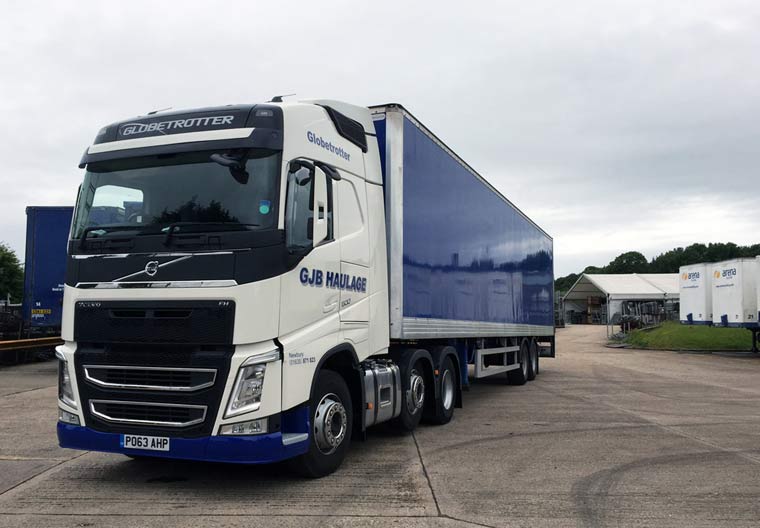 44T lorry towing a hard-sided box trailer ideal for rear loading with its fitted tail lift
